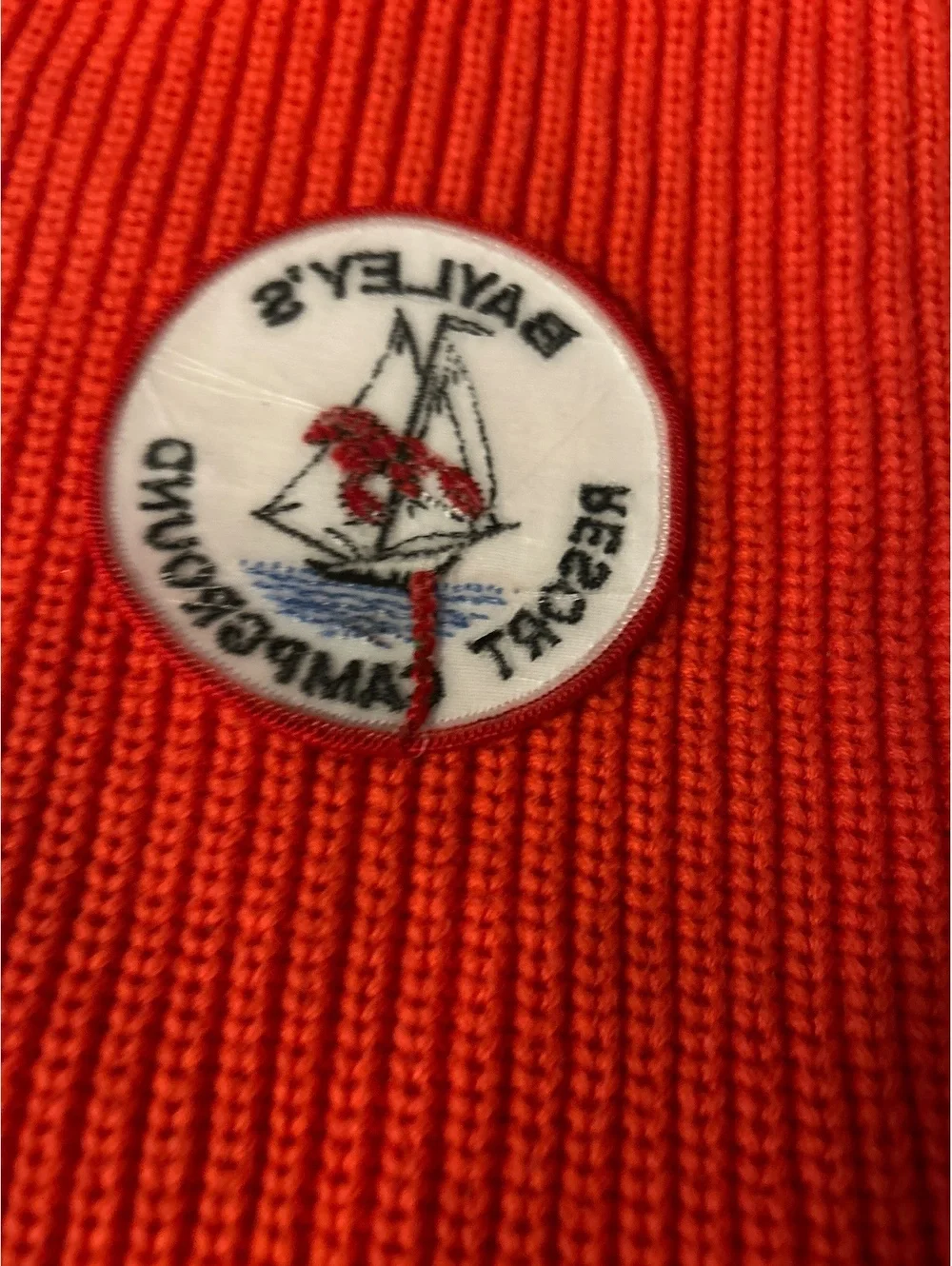 Bayley's Resort Campground Vintage Patch on Orange Knit Fabric